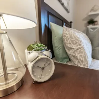 night table with clock and lamp